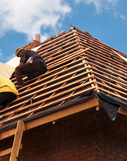 Workers Repairing Roof